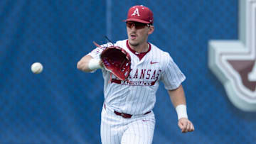 Arkansas Razorbacks' Logan Maxwell (22) catches a bouncing ground ball as Arkansas Razorbacks take on Ole Miss Rebels during the SEC baseball tournament at Hoover Met in Birmingham, Ala., on Friday, May 23, 2025.