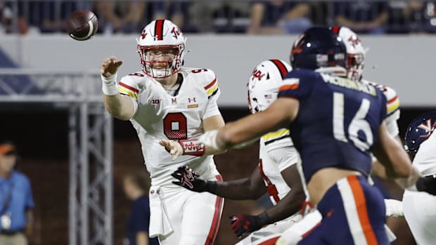 Maryland Terrapins quarterback Billy Edwards Jr. (9) passes the ball to Terrapins running back Roman Hemby (24) as Virginia C