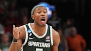 Mar 30, 2025; Atlanta, GA, USA; Michigan State Spartans guard Tre Holloman (5) yells to teammates during the first half in the South Regional final of the 2025 NCAA tournament against the Auburn Tigers at State Farm Arena. Mandatory Credit: Dale Zanine-Imagn Images