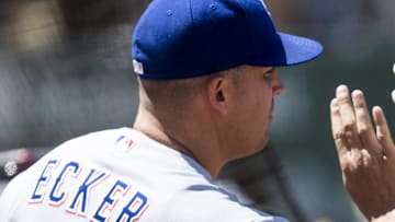 Texas Rangers shortstop Corey Seager (5) is congratulated by bench coach/offensive coordinator Donnie Ecker (14)