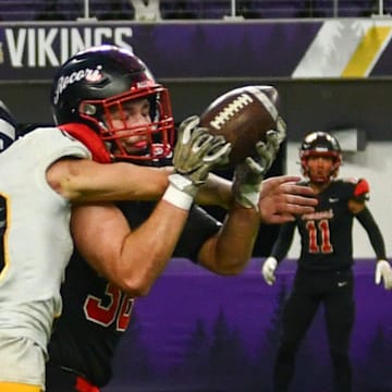 ROCORI football senior Kaden Rausch has a pass broken up by Byron's Kale Robinson on Nov. 16 in the Class 4A state semifinal football game. The Spartans won 7-0.