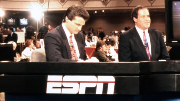 ESPN announcers Mel Kiper Jr. (left) Chris Berman (second from left). Mandatory Credit: Imagn Images