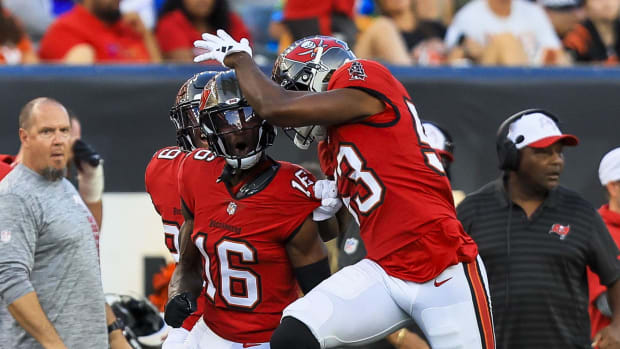 Tampa Bay Buccaneers cornerback Keenan Isaac (16) reacts after intercepting the ball in the first half against the Cincinnati