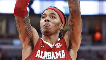 Nov 19, 2025; Chicago, Illinois, USA; Alabama Crimson Tide guard Labaron Philon (0) shoots a free throw against the Illinois Fighting Illini during the second half at United Center. Mandatory Credit: Kamil Krzaczynski-Imagn Images