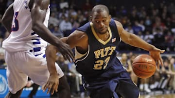 Feb 7, 2009; Rosemont, IL, USA; Pittsburgh Panthers forward Sam Young (23) loses the ball as he drives to the basket against DePaul Blue Demons center Mac Koshwal (13) during the first half at Allstate Arena. Mandatory Credit: Jerry Lai-Imagn Images