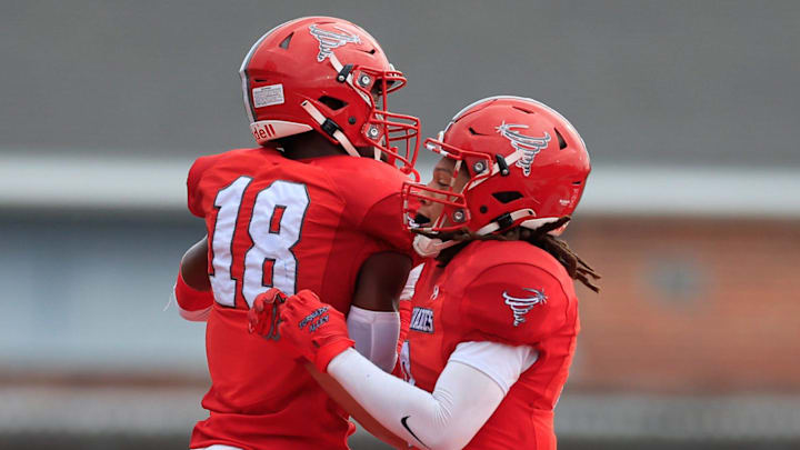 Bradford's Marlin Haywood (18) and Branden Williams (9) celebrate a touchdown score during the first quarter of a high school football matchup Wednesday, Sept. 25, 2024 at Bradford High School in Starke, Fla. The Bradford Tornadoes blanked the Keystone Heights Indians 40-0.
