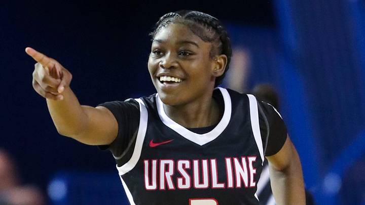 Ursuline's Jezelle \"GG\" Banks reacts after assisting on a basket in the second half of the Raiders' 49-48 win against Caravel in the DIAA championship at the Bob Carpenter Center, Saturday, March 9, 2024.