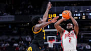 Ohio State Buckeyes guard Bruce Thornton (2) attempts a 3-pointer against Iowa Hawkeyes guard Drew Thelwell (3) on Wednesday, March 12, 2025, in a first round game at the 2025 TIAA Big Ten Men’s Basketball Tournament between the Iowa Hawkeyes and the Ohio State Buckeyes at Gainbridge Fieldhouse in Indianapolis.