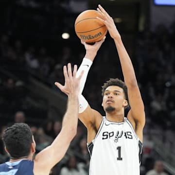 Jan 17, 2025; San Antonio, Texas, USA; San Antonio Spurs center Victor Wembanyama (1) shoots in front of Memphis Grizzlies forward Santi Aldama (7) in the second half at Frost Bank Center.