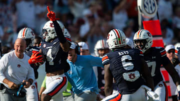 Auburn Tigers defensive back Kayin Lee (4) celebrates his interception as Auburn Tigers take on Arkansas Razorbacks at Jordan-Hare Stadium in Auburn, Ala., on Saturday, Sept. 21, 2024. Arkansas Razorbacks defeated Auburn Tigers 24-14.