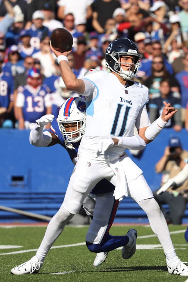 Bills cornerback Christian Benford gets an arm around Titans quarterback Mason Rudolph to sack him