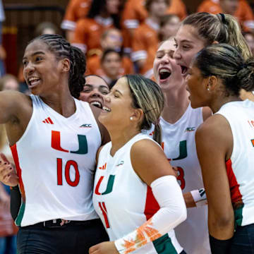 Miami Hurricanes Volleyball celebrating a set victory over No. 1 Texas 