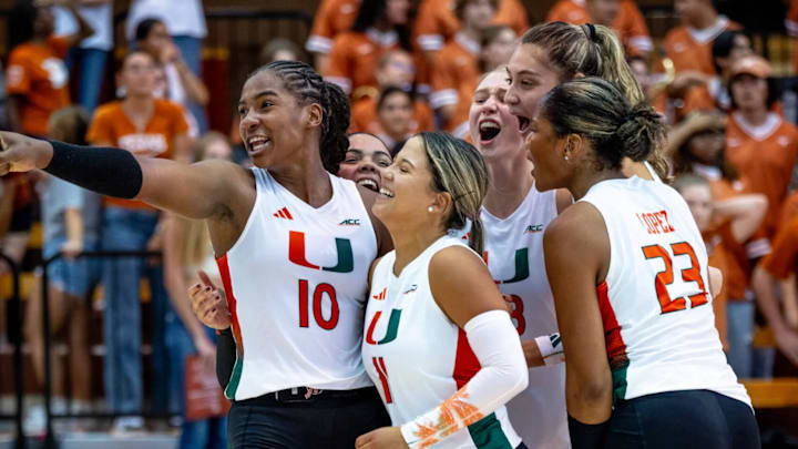 Miami Hurricanes Volleyball celebrating a set victory over No. 1 Texas 