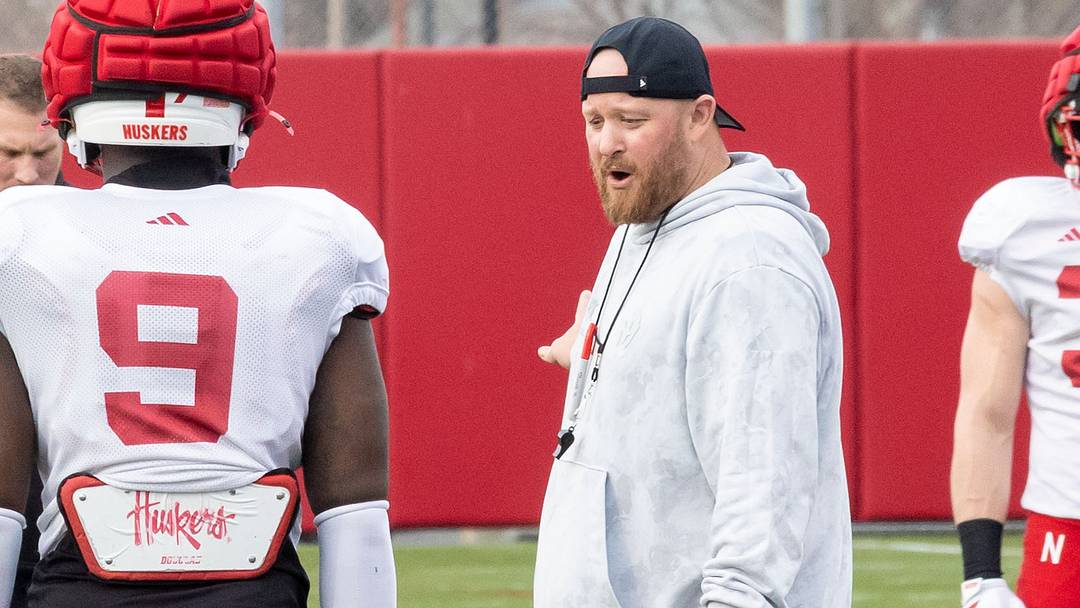 Rob Aurich instructs linebacker Vincent Shavers during spring practice.