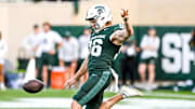 Michigan State's Ryan Eckley punts against Washington during the second quarter on Saturday, Sept. 16, 2023, at Spartan Stadium in East Lansing.