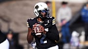 Nov 29, 2024; Boulder, Colorado, USA; Colorado Buffaloes quarterback Shedeur Sanders (2) prepares to pass in the second quarter against the Oklahoma State Cowboys at Folsom Field. Mandatory Credit: Ron Chenoy-Imagn Images