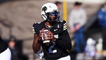 Nov 29, 2024; Boulder, Colorado, USA; Colorado Buffaloes quarterback Shedeur Sanders (2) prepares to pass in the second quarter against the Oklahoma State Cowboys at Folsom Field. Mandatory Credit: Ron Chenoy-Imagn Images