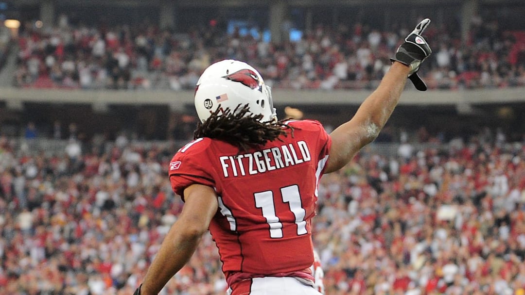 Dec. 28, 2008; Glendale, AZ, USA; Arizona Cardinals wide receiver Larry Fitzgerald celebrates a touchdown against the Seattle Seahawks at University of Phoenix Stadium. Mandatory Credit: Mark J. Rebilas-Imagn Images