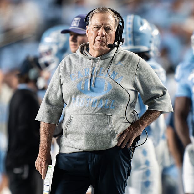 Bill Belichick stands with one hand on his hip during the game against TCU.