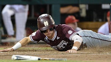 Jun 20, 2019; Omaha, NE, USA; Mississippi State Bulldogs outfielder Jake Mangum (15) scores a run in the seventh inning against the Louisville Cardinals in the 2019 College World Series at TD Ameritrade Park. Mandatory Credit: Steven Branscombe-Imagn Images