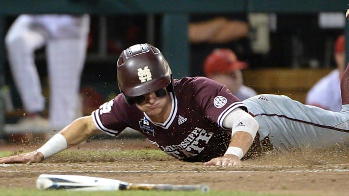 Jun 20, 2019; Omaha, NE, USA; Mississippi State Bulldogs outfielder Jake Mangum (15) scores a run in the seventh inning against the Louisville Cardinals in the 2019 College World Series at TD Ameritrade Park. Mandatory Credit: Steven Branscombe-Imagn Images