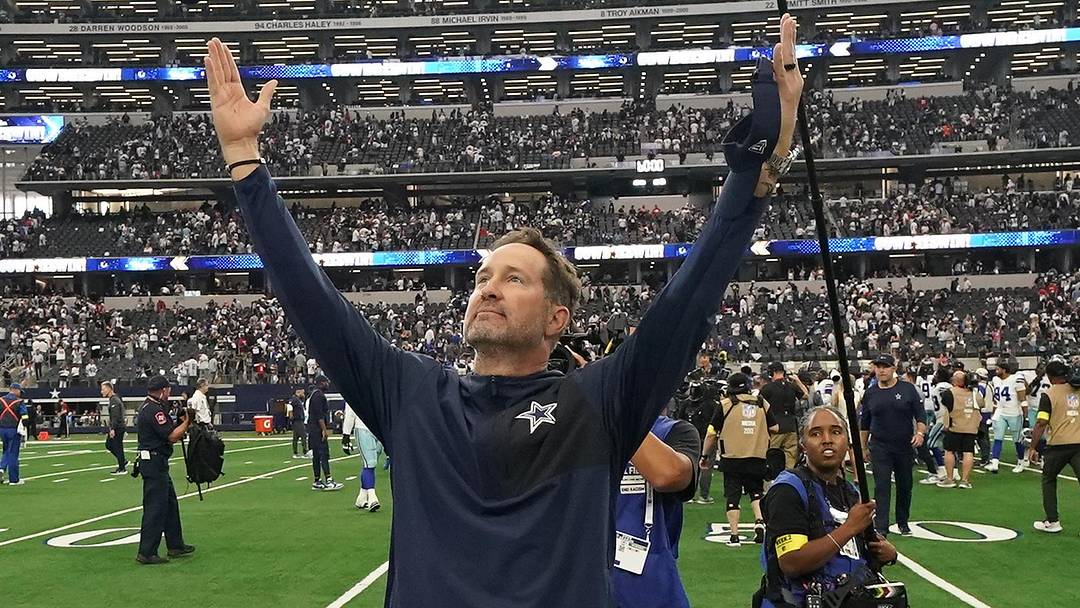 Sep 14, 2025; Arlington, Texas, USA; Dallas Cowboys head coach Brian Schottenheimer gestures to fans after the game against the New York Giants at AT&T Stadium. Mandatory Credit: Raymond Carlin III-Imagn Images
