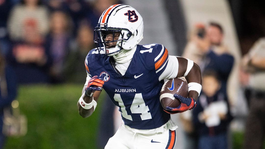 Auburn Tigers defensive back Rayshawn Pleasant (14) returns a kick as Auburn Tigers take on Kentucky Wildcats at Jordan-Hare Stadium in Auburn, Ala. on Saturday, Nov. 1, 2025. Kentucky Wildcats defeated Auburn Tigers 10-3.