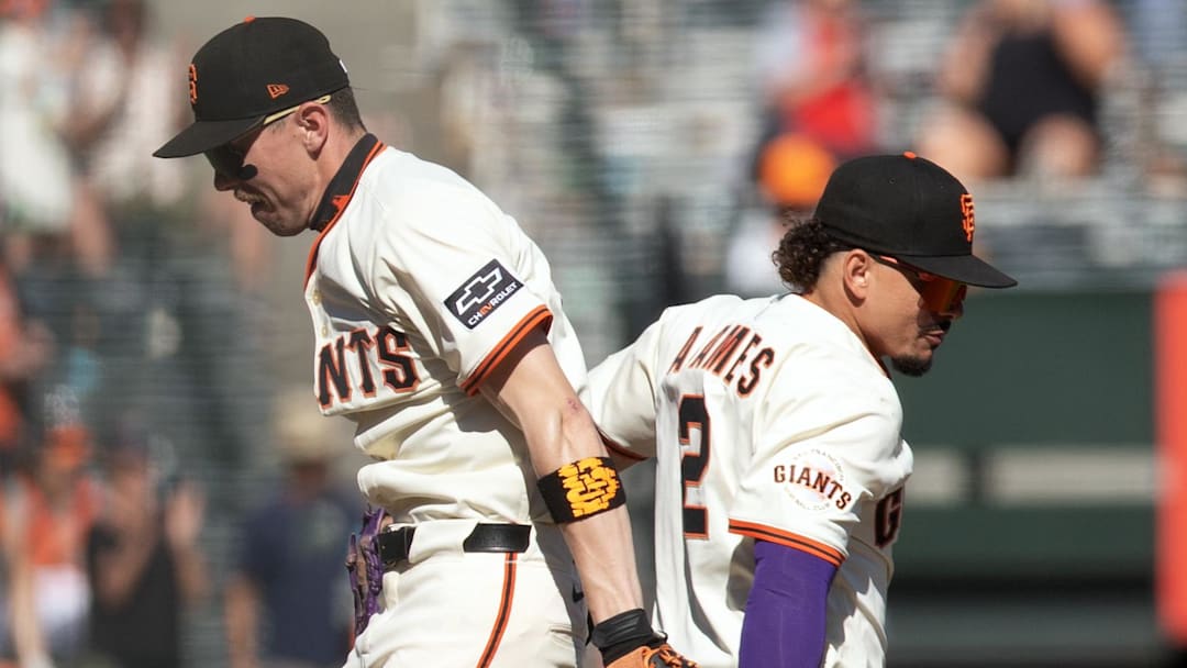 San Francisco Giants second baseman Christian Koss (left) and shortstop Willy Adames (2) celebrate an August 2025 victory