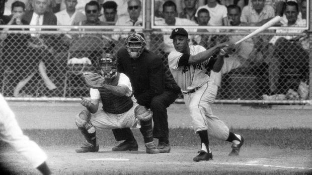 Willie Mays swings while at the plate