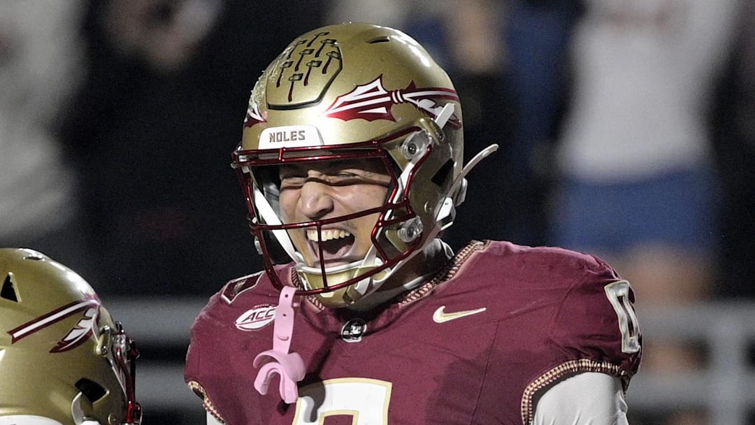 Nov 1, 2025; Tallahassee, Florida, USA; Florida State Seminoles quarterback Tommy Castellanos (1) celebrates a touchdown with wide receiver Duce Robinson (0) during the second half against the Wake Forest Demon Deacons at Doak S. Campbell Stadium. Mandatory Credit: Melina Myers-Imagn Images