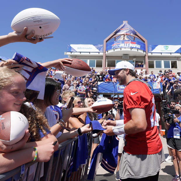 Buffalo Bills' quarterback Josh Allen meeting fans and signing various items.