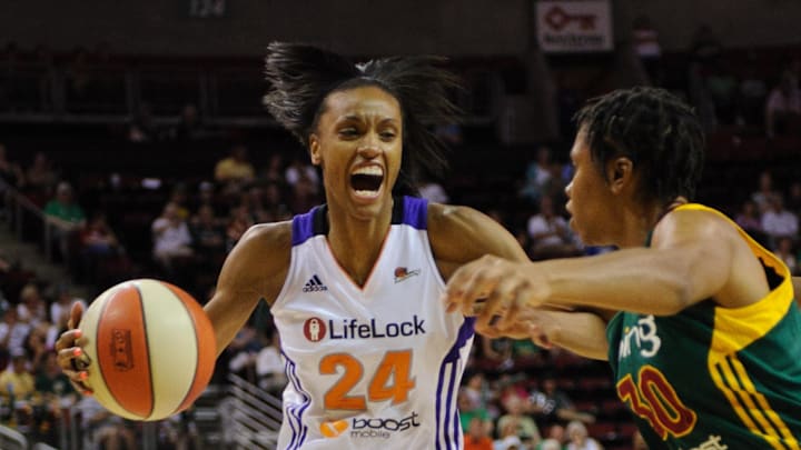 Jul 8, 2012; Seattle, WA, USA; Phoenix Mercury forward DeWanna Bonner (24) moves towards the basket while being guarded by Seattle Storm guard Tanisha Wright (30) during the 1st half at KeyArena. Mandatory Credit: Steven Bisig-Imagn Images