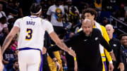 Apr 14, 2024; New Orleans, Louisiana, USA; Los Angeles Lakers head coach Darvin Ham slaps hands with center Anthony Davis.