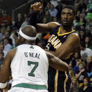 January 6, 2012; Boston, MA, USA; Indiana Pacers center Roy Hibbert (55) passes the ball over Boston Celtics center Jermaine O'Neal (7) during the fourth quarter at TD Garden. Mandatory Credit: Bob DeChiara-USA TODAY Sports