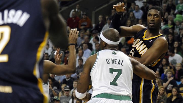 January 6, 2012; Boston, MA, USA; Indiana Pacers center Roy Hibbert (55) passes the ball over Boston Celtics center Jermaine O'Neal (7) during the fourth quarter at TD Garden. Mandatory Credit: Bob DeChiara-USA TODAY Sports