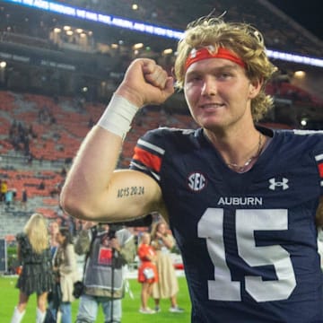 Auburn Tigers quarterback Hank Brown walks off the field after throwing four touchdowns against New Mexico.