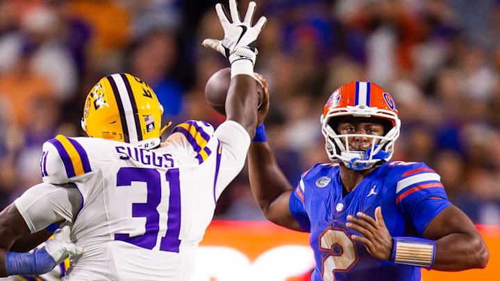 Florida Gators quarterback DJ Lagway (2) throws under pressure from LSU Tigers defensive tackle Jay'viar Suggs (31) during the second half at Ben Hill Griffin Stadium in Gainesville, FL on Saturday, November 16, 2024. The Gators defeated the Tigers 27-16. [Doug Engle/Gainesville Sun]