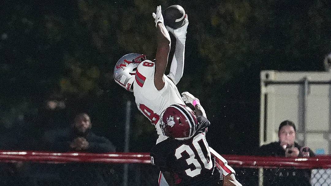 Ramar Thomas of Catholic Memorial makes the touchdown catch against Max Raymond of Brockton during their game on Friday, Oct. 2, 2026. Catholic Memorial has been a steady presence at No. 2 in the New England Top 25.