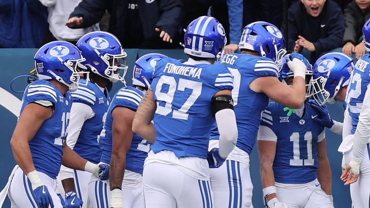 Nov 29, 2025; Provo, Utah, USA; The BYU Cougars celebrate a punt return for a touchdown by wide receiver Parker Kingston (11) during the second half against the UCF Knights at LaVell Edwards Stadium. Mandatory Credit: Rob Gray-Imagn Images