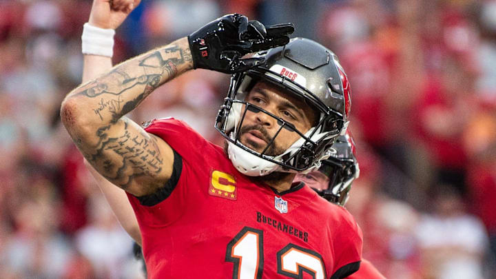 Dec 24, 2023; Tampa, Florida, USA; Tampa Bay Buccaneers wide receiver Mike Evans (13) celebrates the touchdown against the Jacksonville Jaguars in the second quarter at Raymond James Stadium. Mandatory Credit: Jeremy Reper-Imagn Images