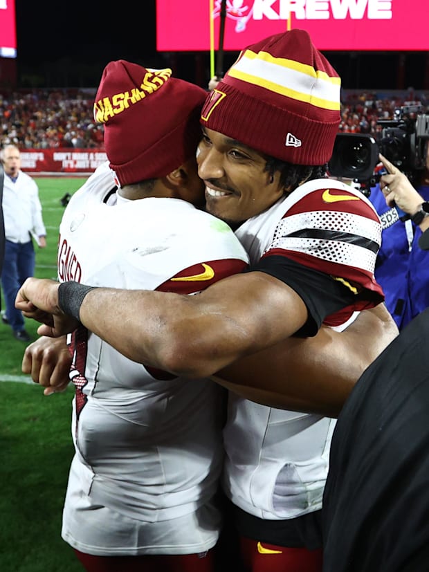 Washington Commanders quarterback Jayden Daniels (5) celebrates with linebacker Bobby Wagner (54).