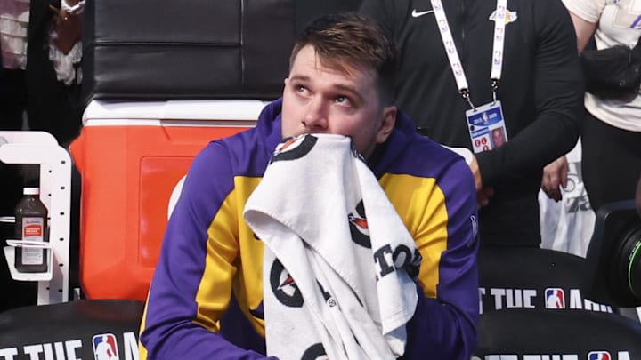 Doncic reacts while watching a tribute video. Doncic reacts while watching a tribute video.