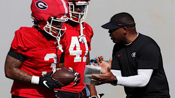 Georgia running backs Josh Crawford works with Georgia running backs Andrew Paul (3) and Georgia running back Len'Neth Whitehead (41) during spring practice in Athens, Ga., on Thursday, March 14, 2024.