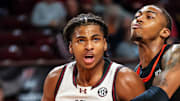 Nov 21, 2024; Columbia, South Carolina, USA; South Carolina Gamecocks forward Collin Murray-Boyles (30) is fouled by Mercer Bears forward Alex Holt (6) in the first half at Colonial Life Arena. Mandatory Credit: Jeff Blake-Imagn Images