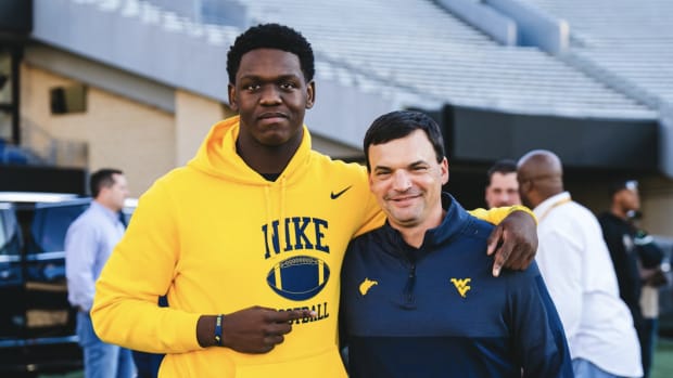 Defensive end Wilnerson Telemaque on his WVU visit with head coach Neal Brown (WVU Athletics Communications)