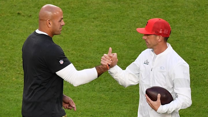 Feb 2, 2020; Miami Gardens, Florida, USA; San Francisco 49ers defensive coordinator Robert Saleh (left) and head coach Kyle Shanahan (right) shake hands prior to the game between the San Francisco 49ers and the Kansas City Chiefs in Super Bowl LIV at Hard Rock Stadium. Mandatory Credit: Jasen Vinlove-Imagn Images