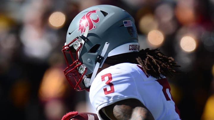 Oct 30, 2021; Tempe, Arizona, USA; Washington State Cougars defensive back Jackson Lataimua (30) runs with the ball against the Arizona State Sun Devils during the first half at Sun Devil Stadium. Mandatory Credit: Joe Camporeale-USA TODAY Sports