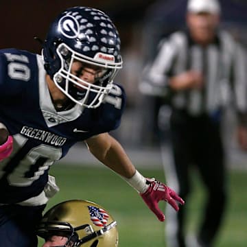 Greenwood's Peyton Presson (10) tries to escape from Pulaski Academy's Jett Smith (20) during the 5A West Conference game on Oct. 28 at Smith Robinson Stadium.

Greenwood Pul Acad Fb 102822 09