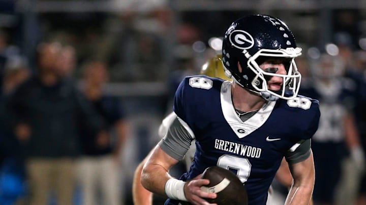 Greenwood's Kane Archer is chased out of the pocket by a Pulaski Academy defender while looking for a receiver during the 5A West Conference game on Oct. 28 at Smith Robinson Stadium.

Greenwood Pul Acad Fb 102822 04