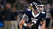 Greenwood's Kane Archer is chased out of the pocket by a Pulaski Academy defender while looking for a receiver during the 5A West Conference game on Oct. 28 at Smith Robinson Stadium.

Greenwood Pul Acad Fb 102822 04